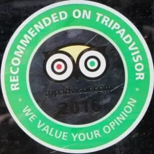 A green circular sticker with the text "RECOMMENDED ON TRIPADVISOR" at the top and "WE VALUE YOUR OPINION" at the bottom. The TripAdvisor owl logo is in the center with the website address and the year 2016.