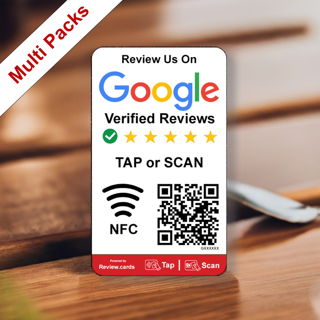 A small card sits on a wooden surface, displaying "Review Us On Google Verified Reviews" with a 5-star rating. It has "TAP or SCAN" with NFC and QR code symbols, and branding from Review.cards. A red diagonal banner reads "Multi Packs" in the top left corner, showcasing it as a Google Smart Review Card Multi Packs - Free Delivery.